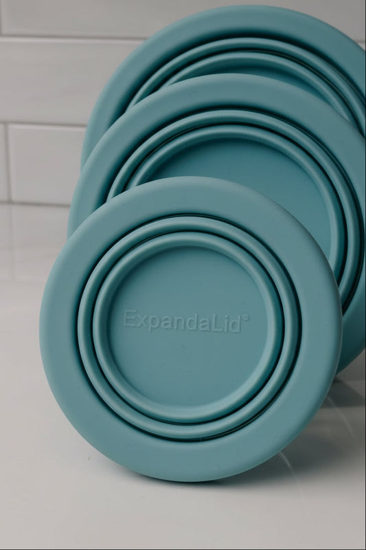 Set of teal expandable lids with 'ExpandeLid' branding on a light gray background